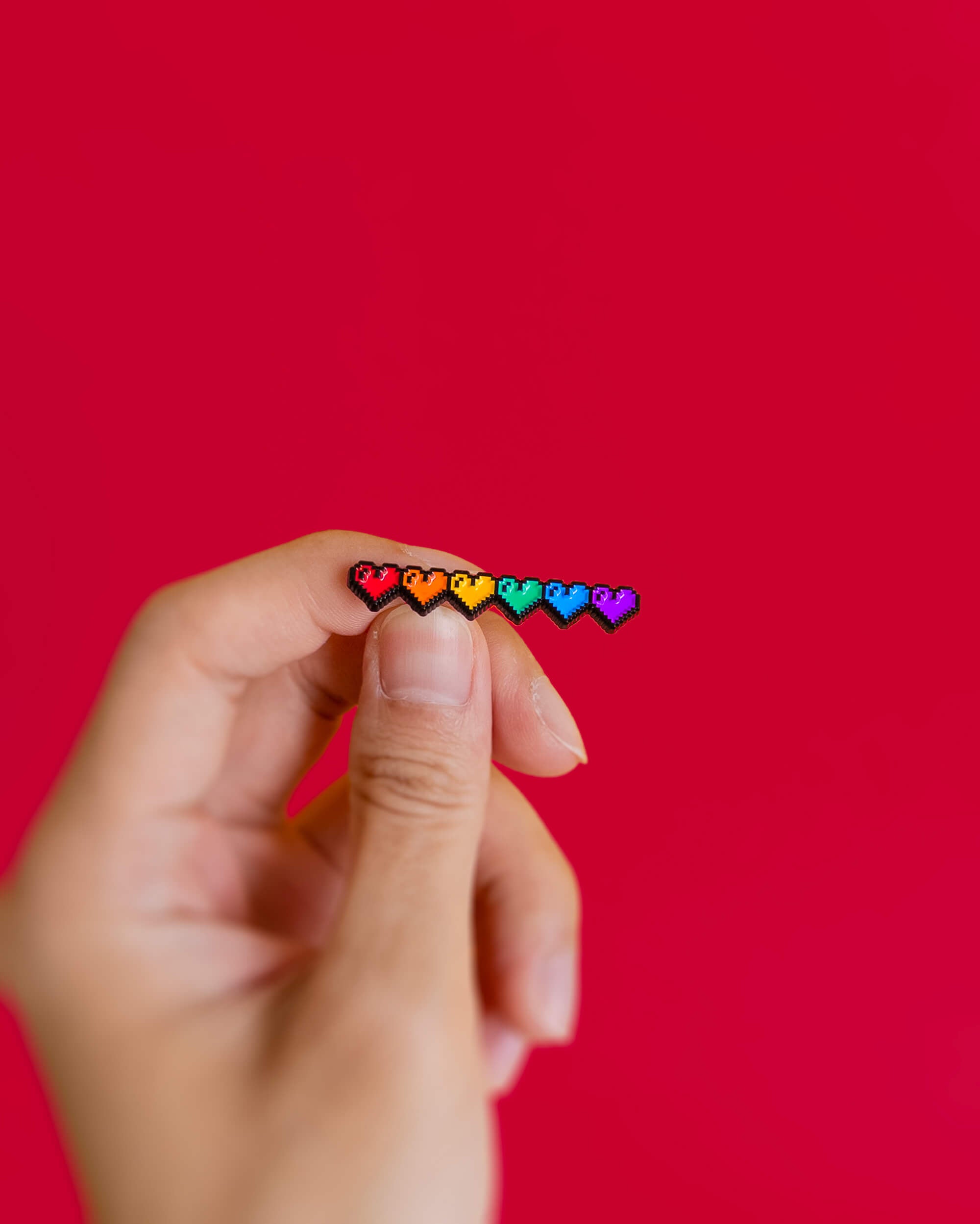 Pixel hearts (rainbow) — enamel pin