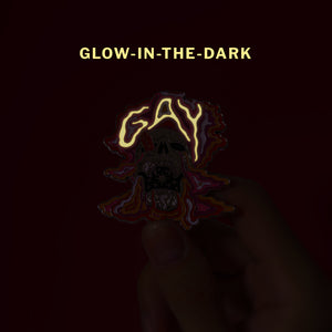 Glow-in-the-dark skull (lesbian) — enamel pin